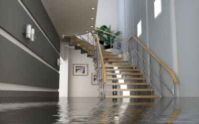 A flooded staircase in the middle of a house.