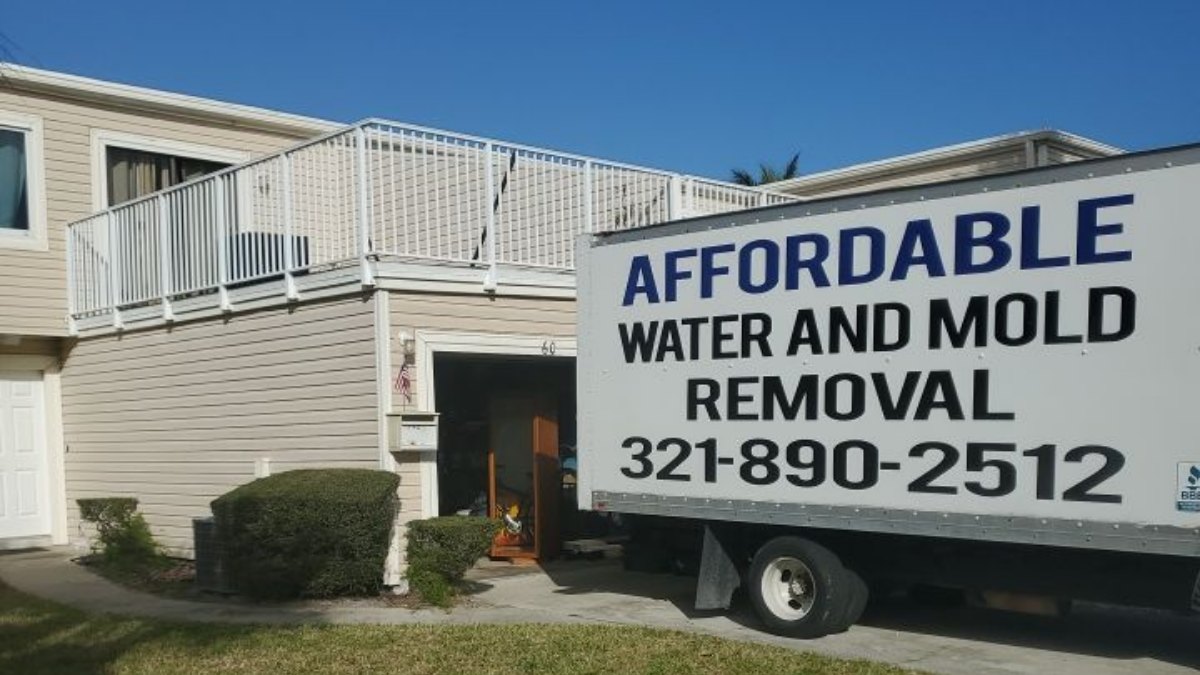 Affordable Water and Mold Removal truck at a job in Satellite Beach, FL