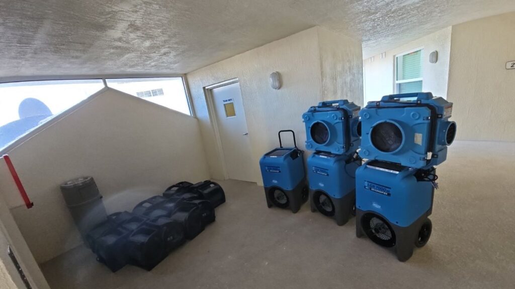 Water damage drying equipment in a condo in Cape Canaveral, FL – Affordable Water and Mold Removal job photo