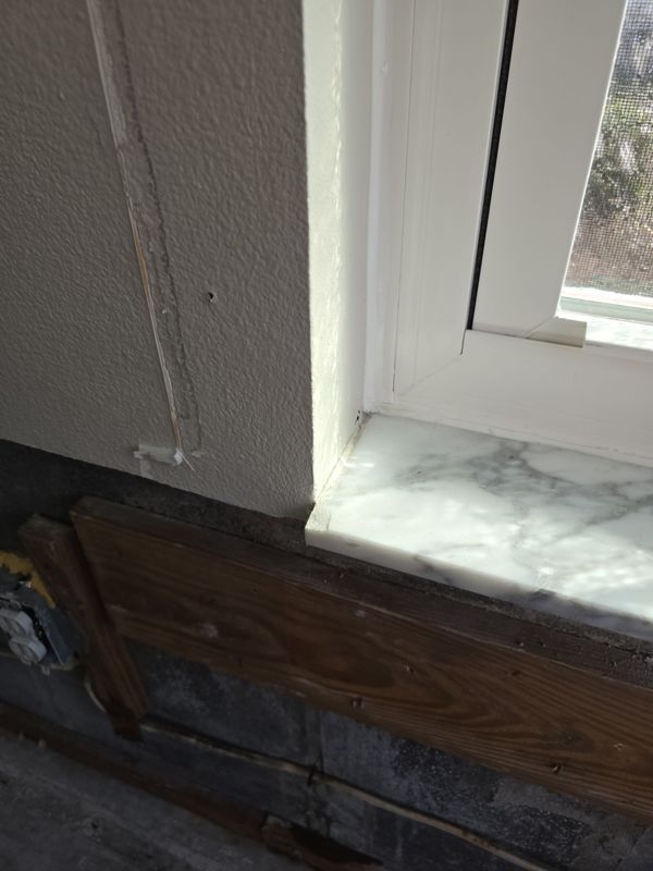 Bedroom window in a Melbourne home with the wall below the sill opened up to check for hidden moisture